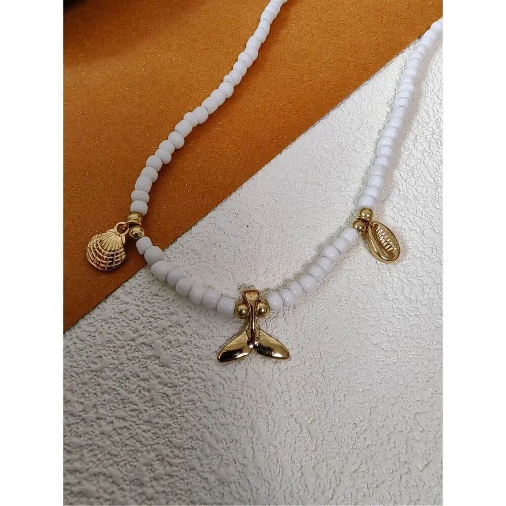 Vivian Seven Gold-tone Shell & Fishtail Charms Clay White Beaded Necklace